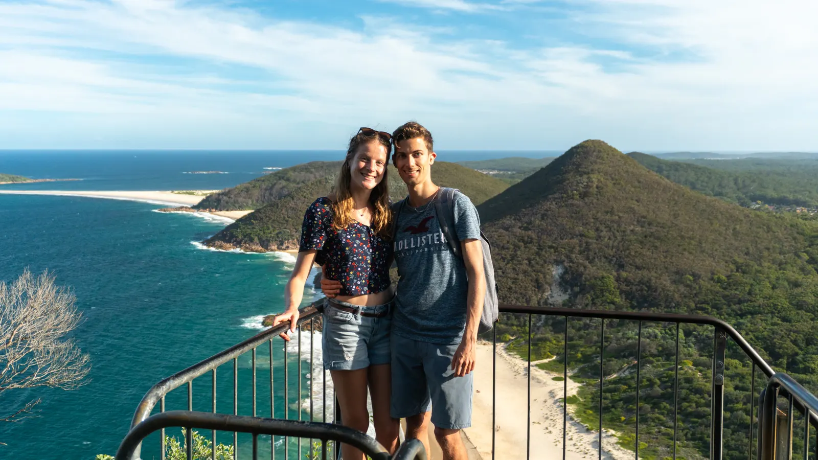 Guillaume and Mylène with a view point on a mount and the beach.
